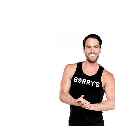 Barry's instructor Alex Sapot in blank tank with hands held