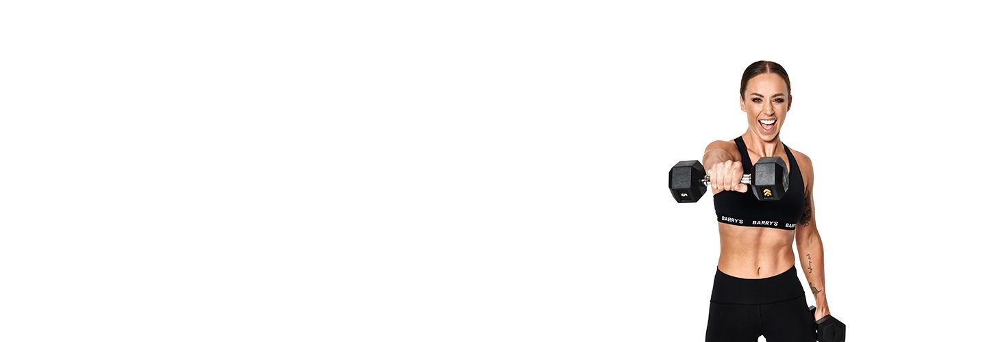 Barry's Bootcamp instructor Alicia Beveridge wearing a black sports bra and punching forward with one dumbbell.