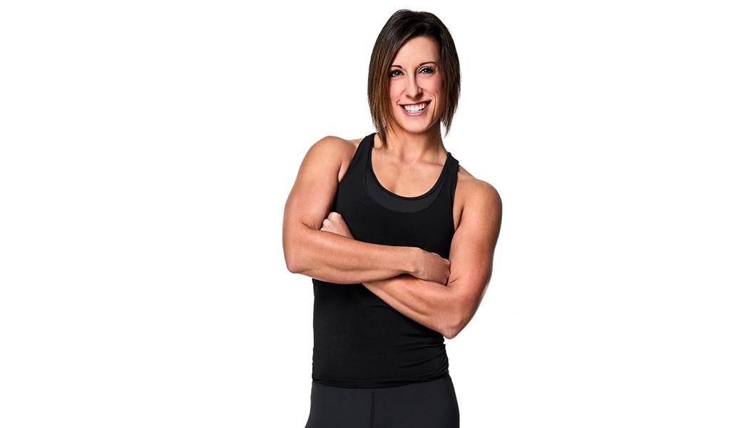 Barry's Amber Rees in black tank with hands crossed