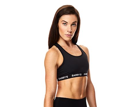 Headshot of instructor Brady Dougherty in black Barry's Bootcamp sports bra on white background