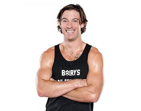 barry's instructor Brian Tschida wearing a black tank