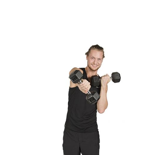 barry's instructor Erik Nordnes wearing black tank posing with dumbbells