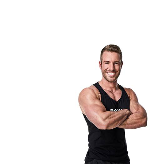 Barry's instructor Josey Greenwell in black tank posing with arms crossed