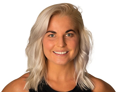 Headshot of Barry's Bootcamp instructor Karoline Pettersson smiling against a white background.