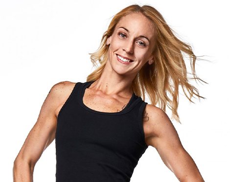 Headshot of Barry's Bootcamp instructor Kelly Whittaker in black tank