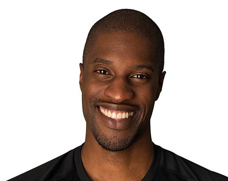 Headshot of Barry's Bootcamp instructor Kevin Ukhagbe smiling against a white background.