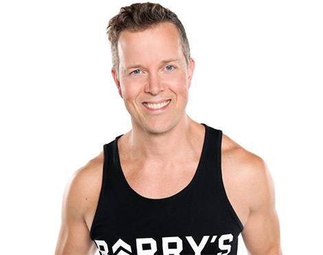 Barry's Instructor Martin George wearing black tank