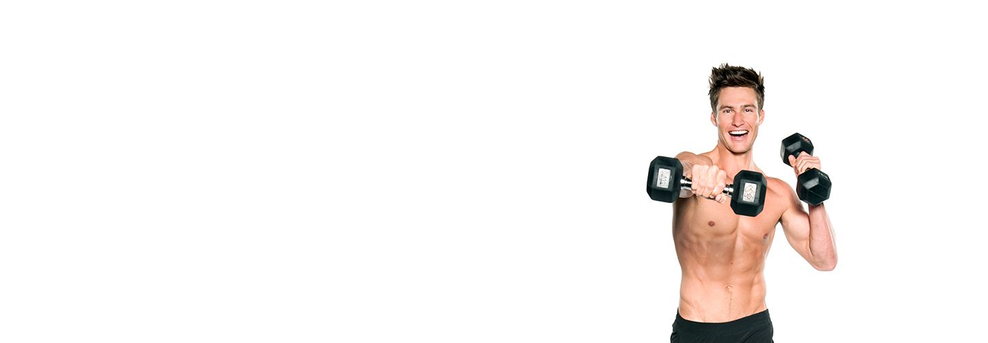 Shirtless Barry's Bootcamp instructor Matt W doing cross punch with dumbbells while smiling on white background