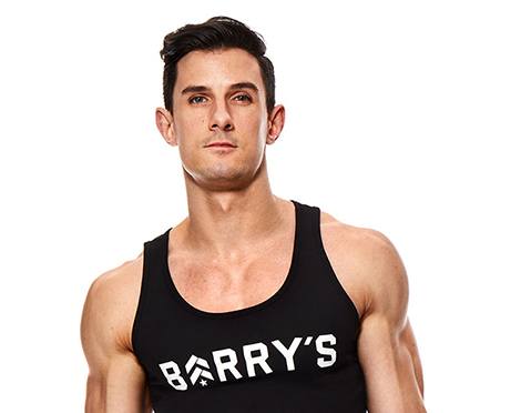 Headshot of instructor Michael Pugliese in black Barry's Bootcamp tank top on white background