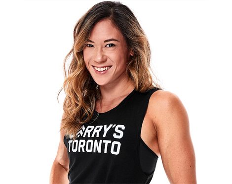 Headshot of instructor Michelle Leung in black Barry's Bootcamp tank top smiling on white background