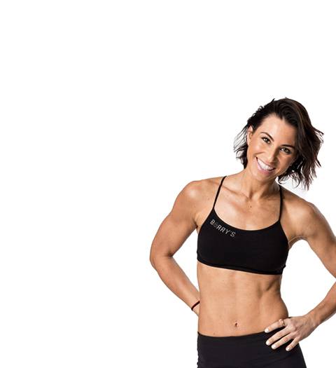 Barry's instructor Rachel Robinson wearing black sports bra with hands on hips
