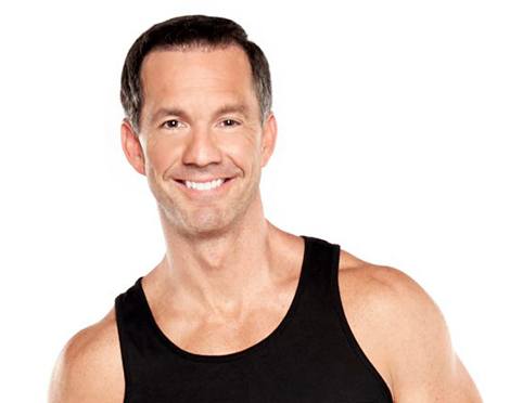 Barrys instructor Scott Haddock wearing black tank