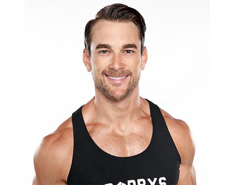 Barry's instructor Tommy Stracke wearing black tank