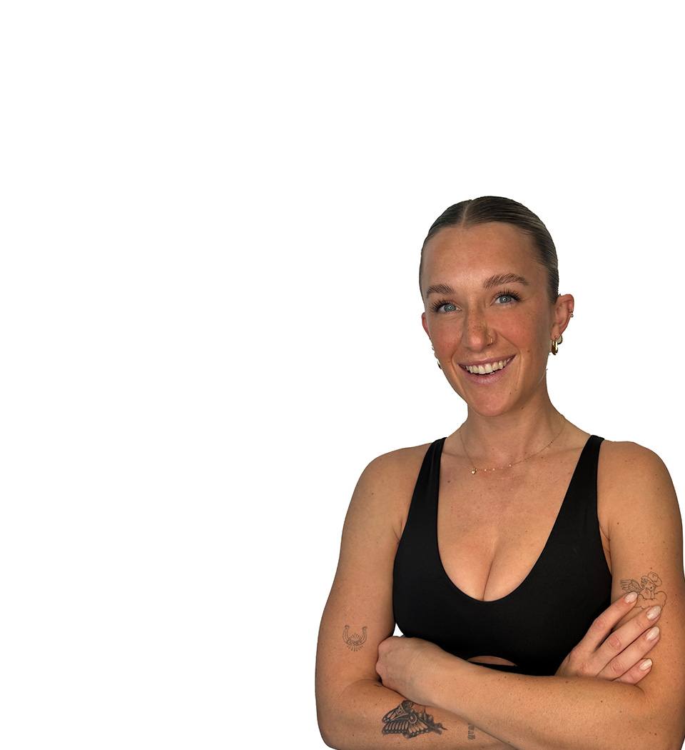 Barry's instructor standing confidently wearing a black top against a white background.