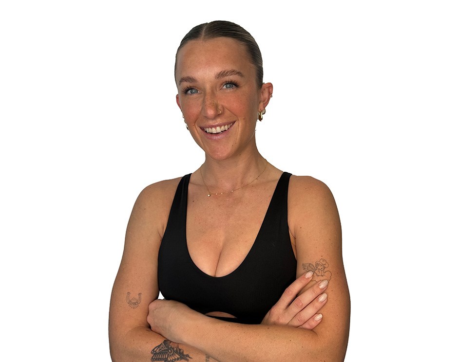 Barry's instructor standing confidently wearing a black top against a white background.