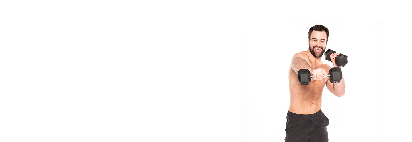 Barry's Bootcamp instructor Ben Zerbst shirtless punching with dumbbells against white background.