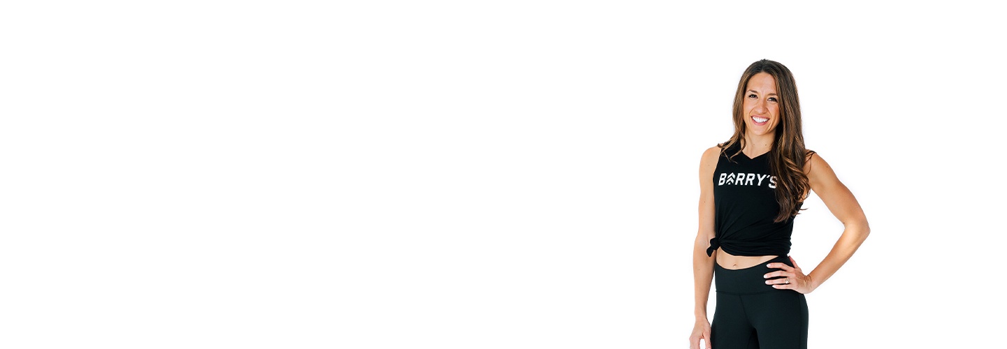 Headshot of instructor Ives Hot in Barry's Bootcamp tank top smiling on white background