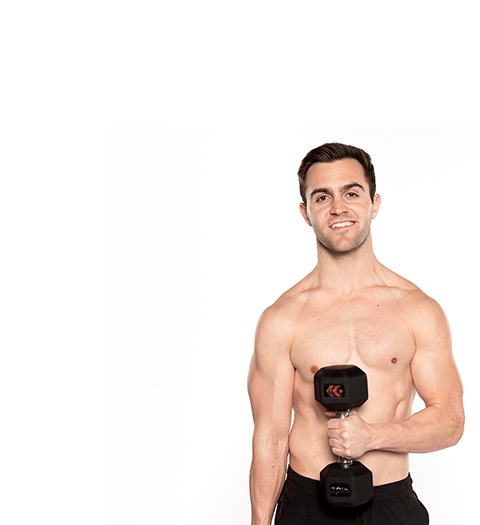 Headshot of Barry's Bootcamp instructor Kael Williams shirtless and holding a dumbbell up vertically against a white background.