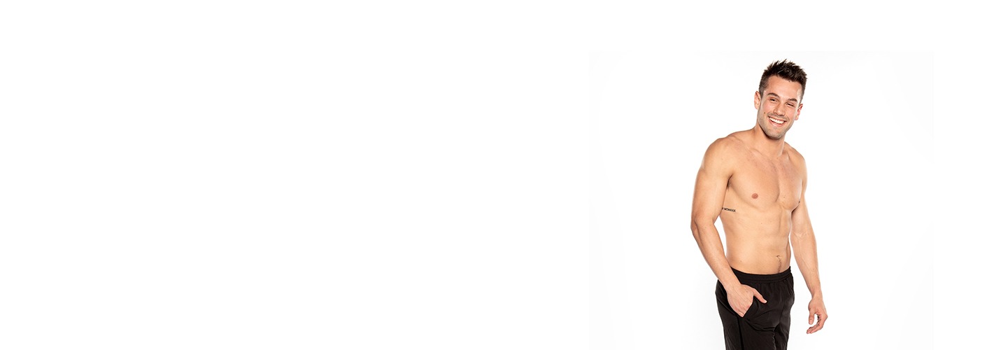 Barry's Bootcamp instructor Nick Tipple shirtless and smiling against a white background.