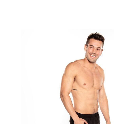 Barry's Bootcamp instructor Nick Tipple shirtless and smiling against a white background.