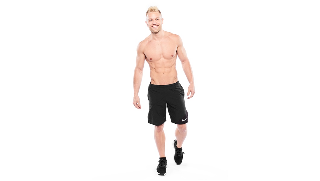 Barry’s instructor shirtless standing confidently smiling against a white background