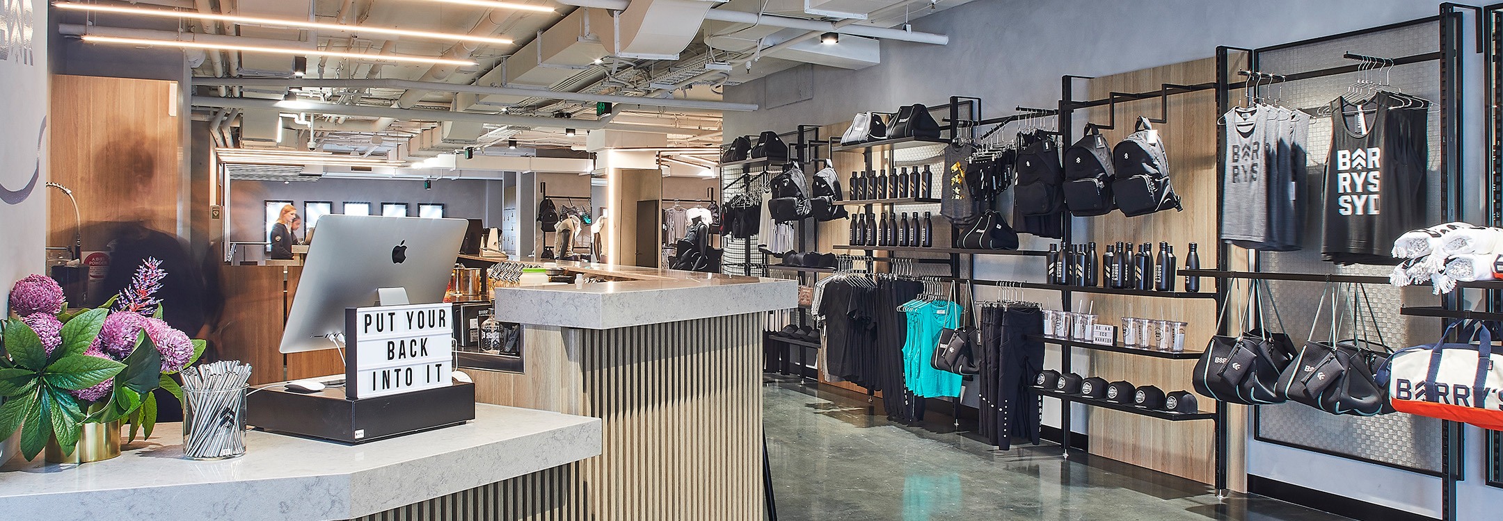 Clothing racks and shelves in reception area of Martin Place Barry's Bootcamp studio