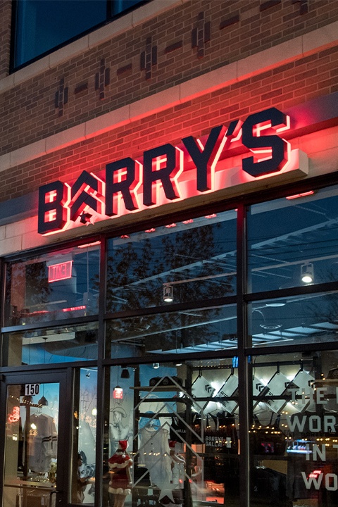 Barry's sign with red backlighting outside of Dallas studio location