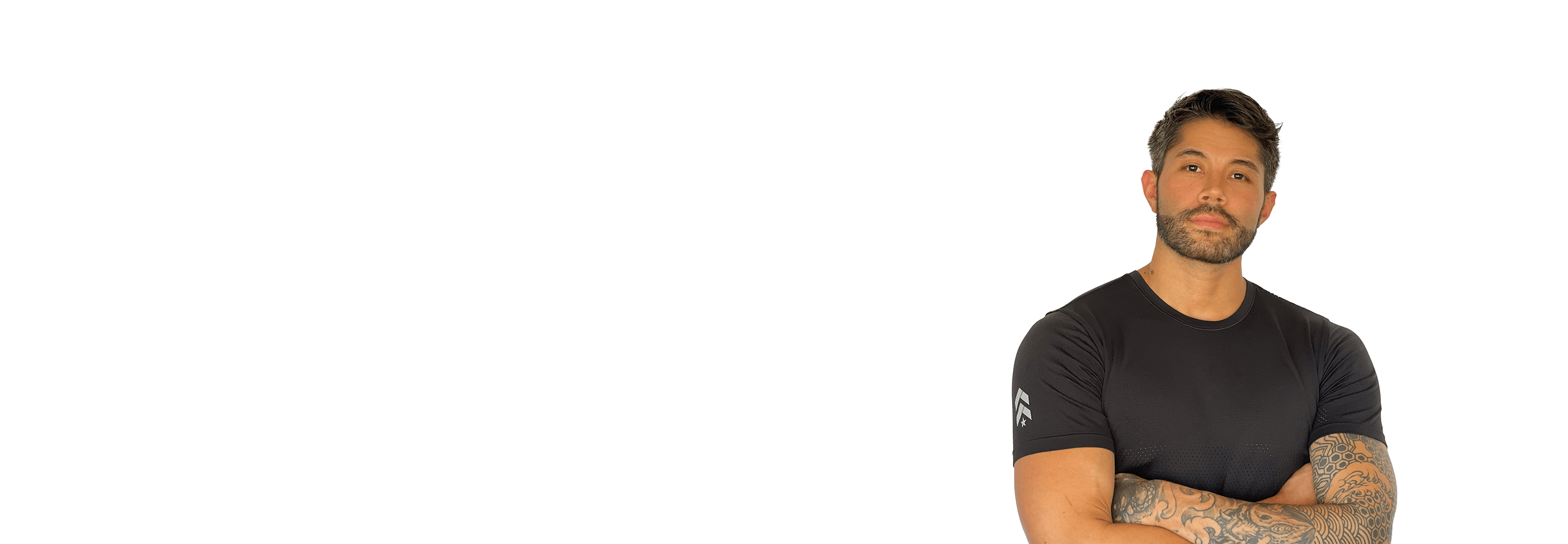 Barry's instructor standing confidently wearing a black top against a white background.