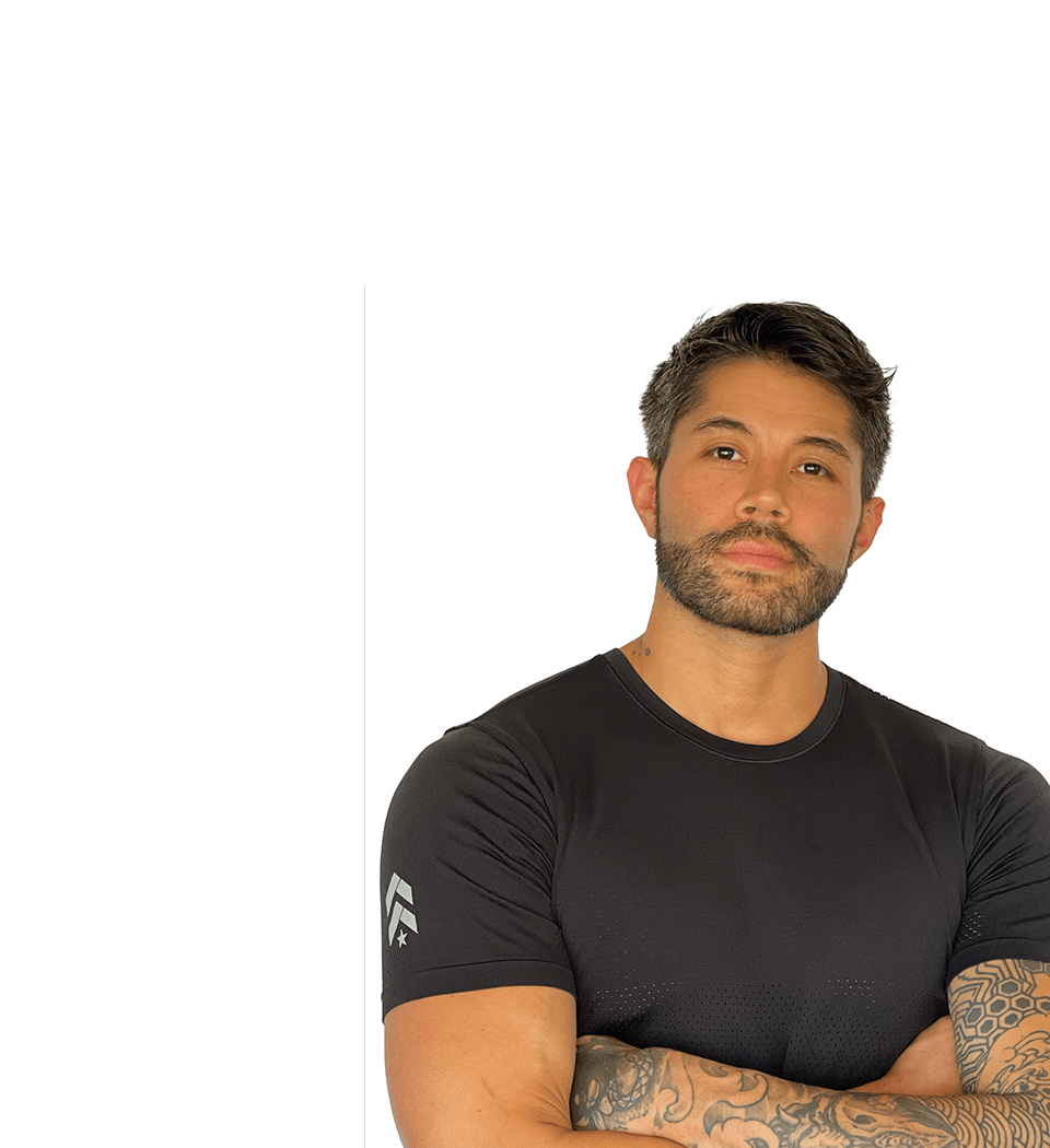 Barry's instructor standing confidently wearing a black top against a white background.