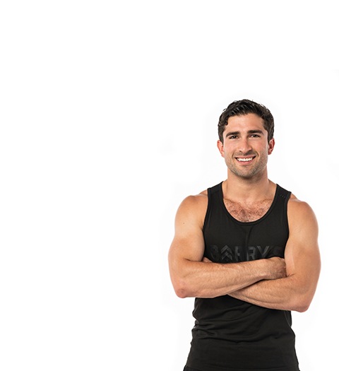 Barry's instructor standing confidently wearing a black top against a white background.