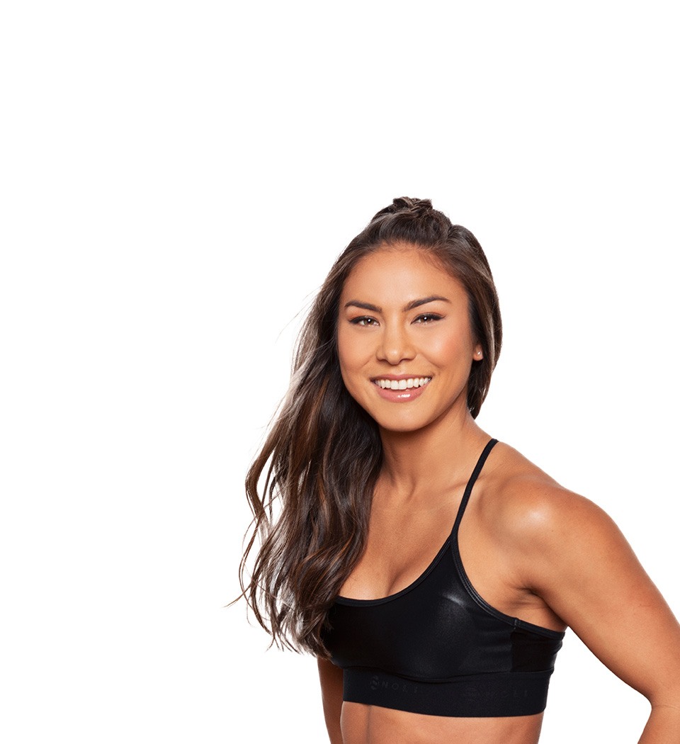 Barry's instructor standing confidently wearing a black top against a white background.