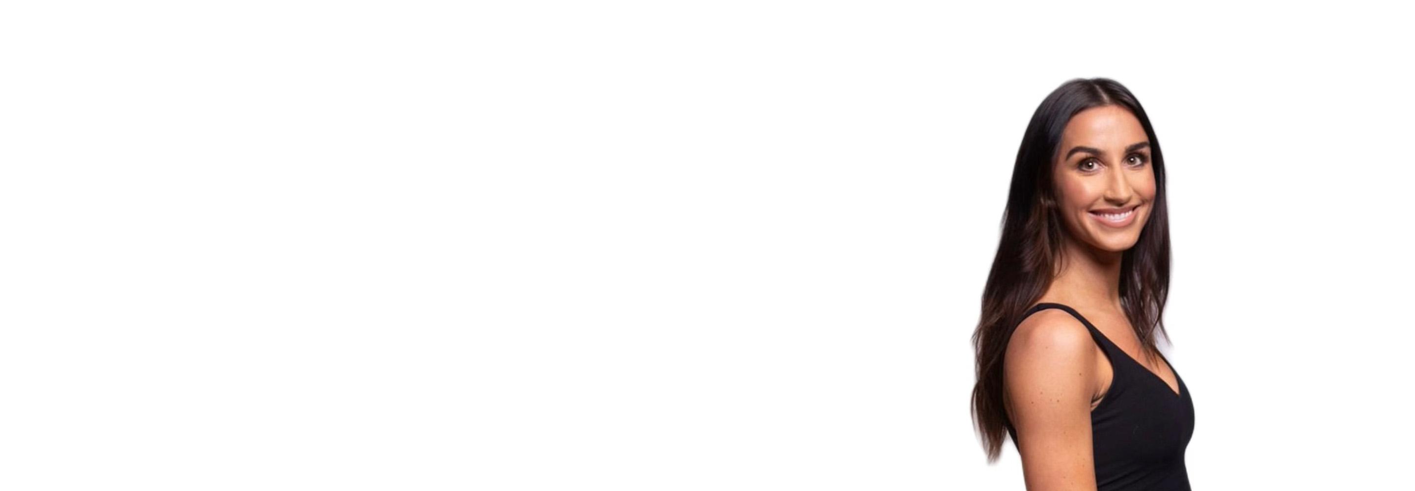 Barry's instructor standing confidently wearing a black top against a white background.