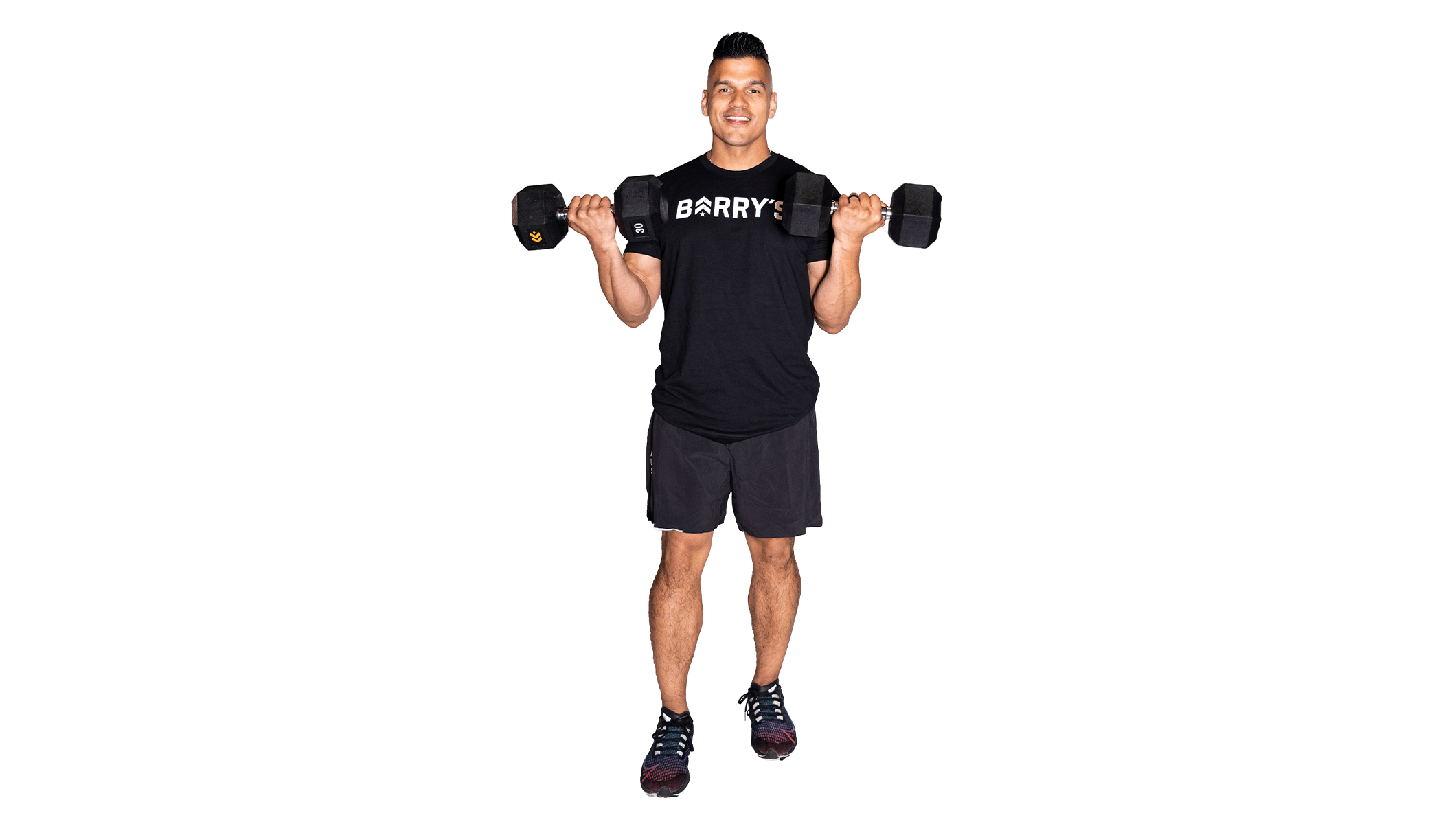 Barry’s instructor wearing a black top standing confidently smiling against a white background holding weights out to the side