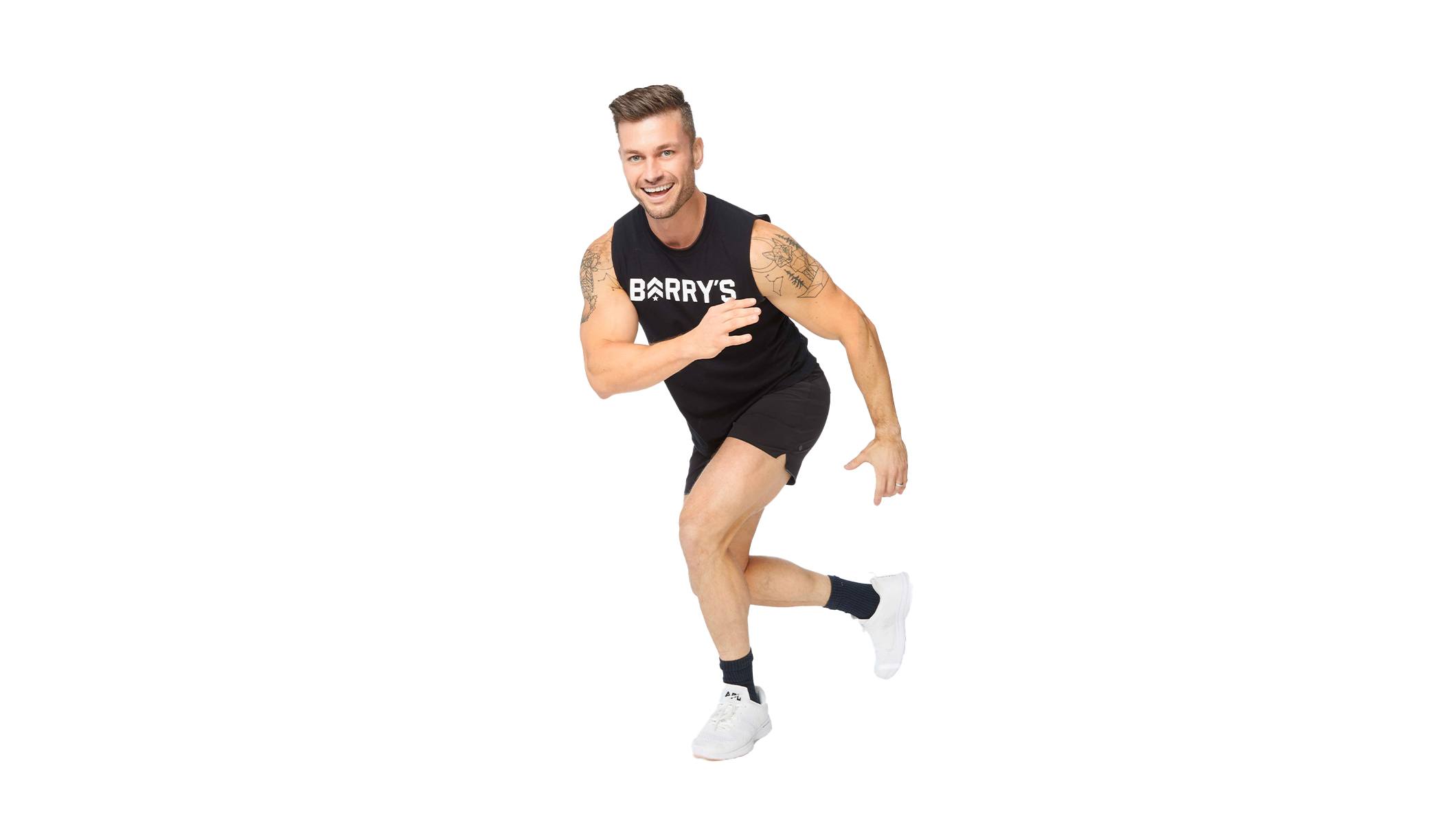 Barry's instructor running, wearing a black tank top against a white background, ready for the next workout challenge.