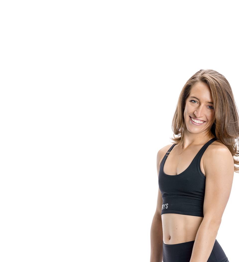 Barry's instructor standing confidently wearing a black top against a white background.