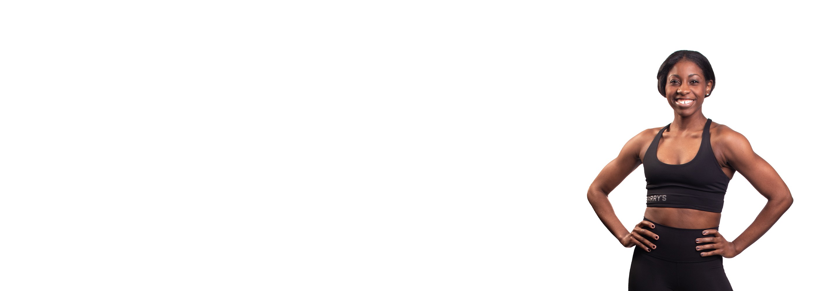 Barry's instructor standing confidently wearing a black top against a white background.