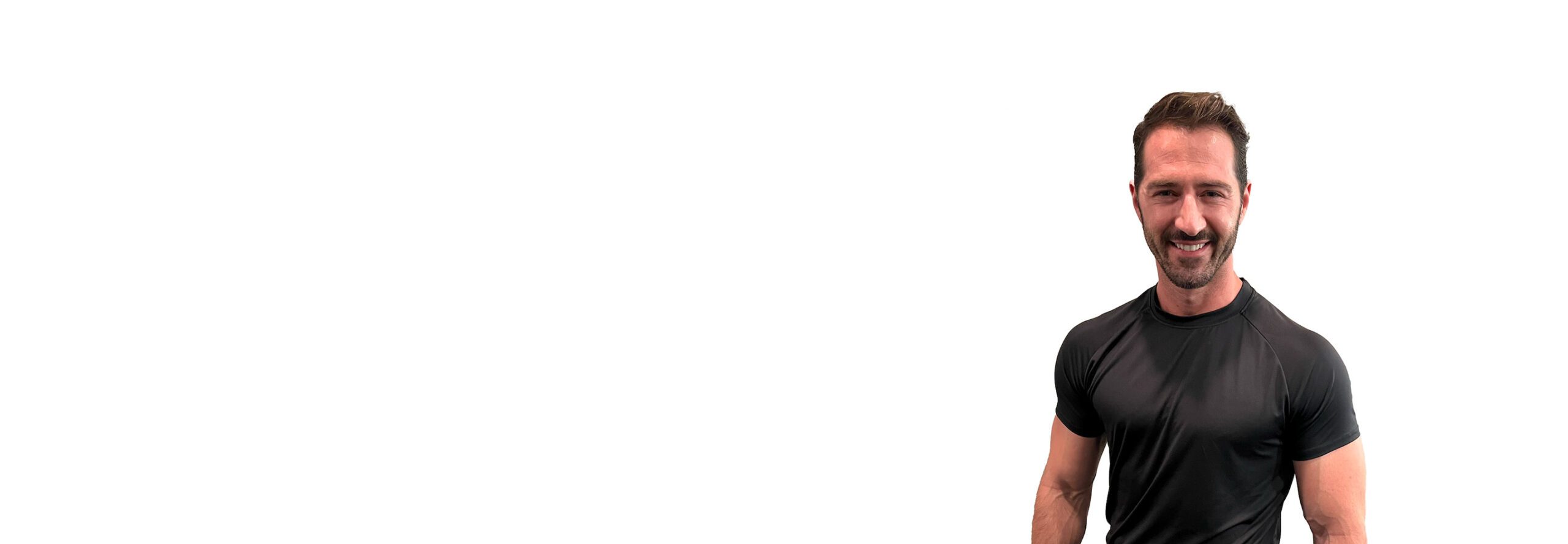 Barry's instructor standing confidently wearing a black top against a white background.