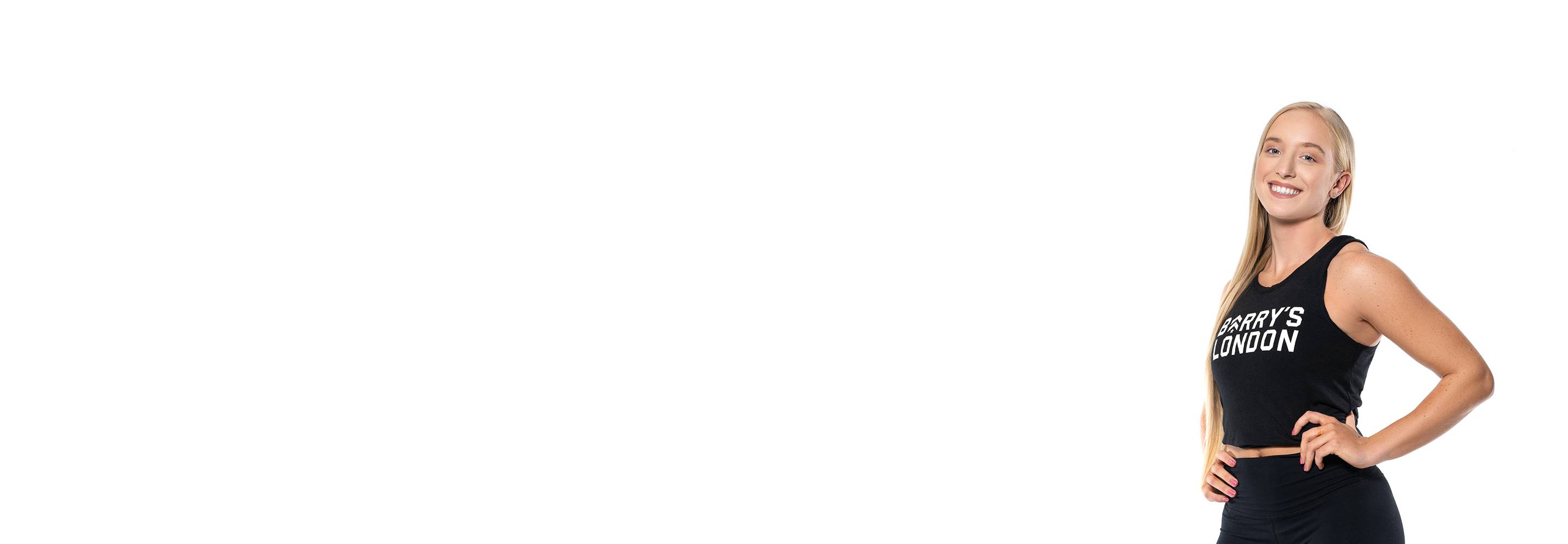 Barry's instructor standing confidently wearing a black top against a white background.