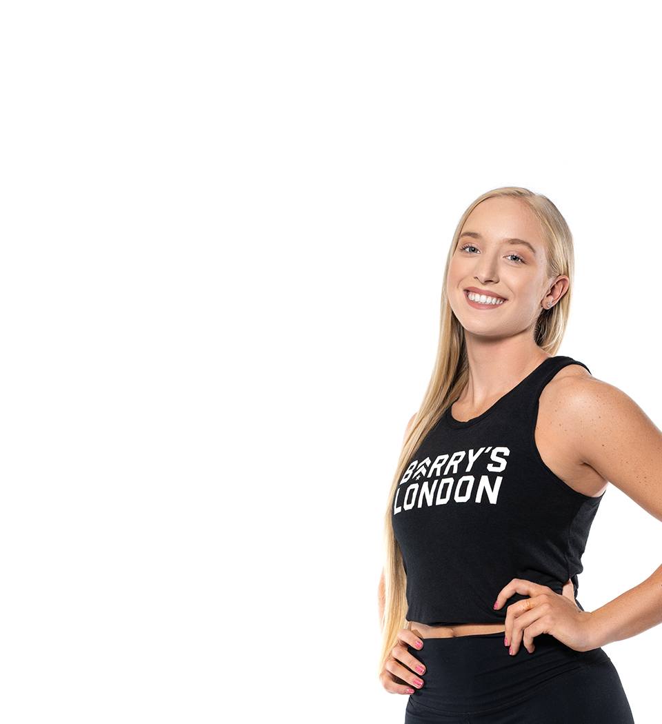 Barry's instructor standing confidently wearing a black top against a white background.