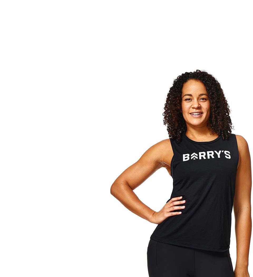 Barry's instructor standing confidently wearing a black top against a white background.