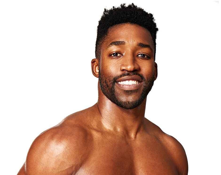 Barry’s instructor shirtless standing confidently smiling against a white background