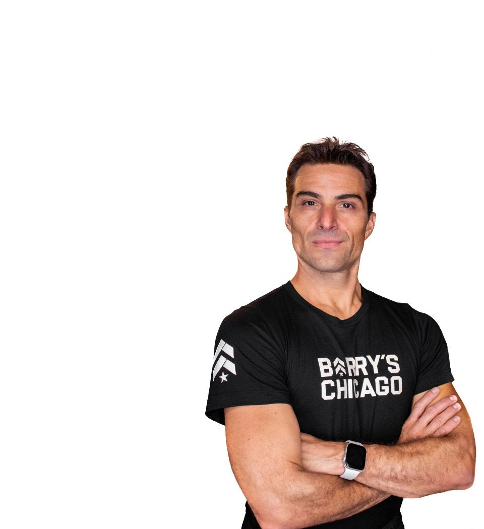 Barry's instructor standing confidently wearing a black top against a white background.