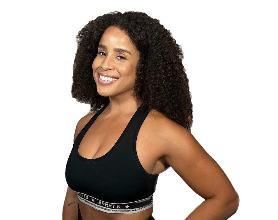 Barry's instructor standing confidently wearing a black top against a white background.