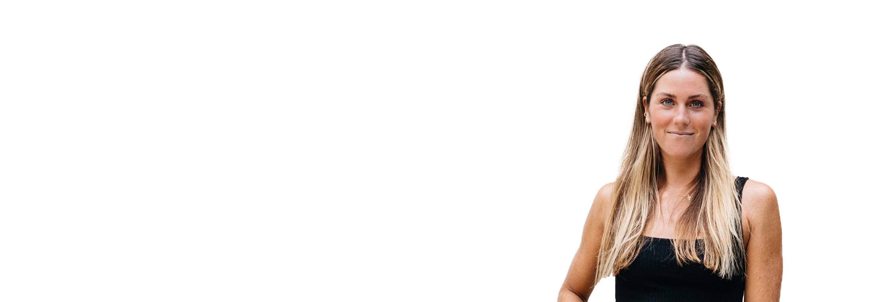 Barry's instructor standing confidently wearing a black top against a white background.