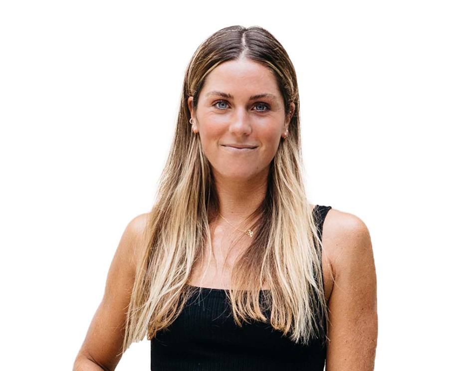 Barry's instructor standing confidently wearing a black top against a white background.