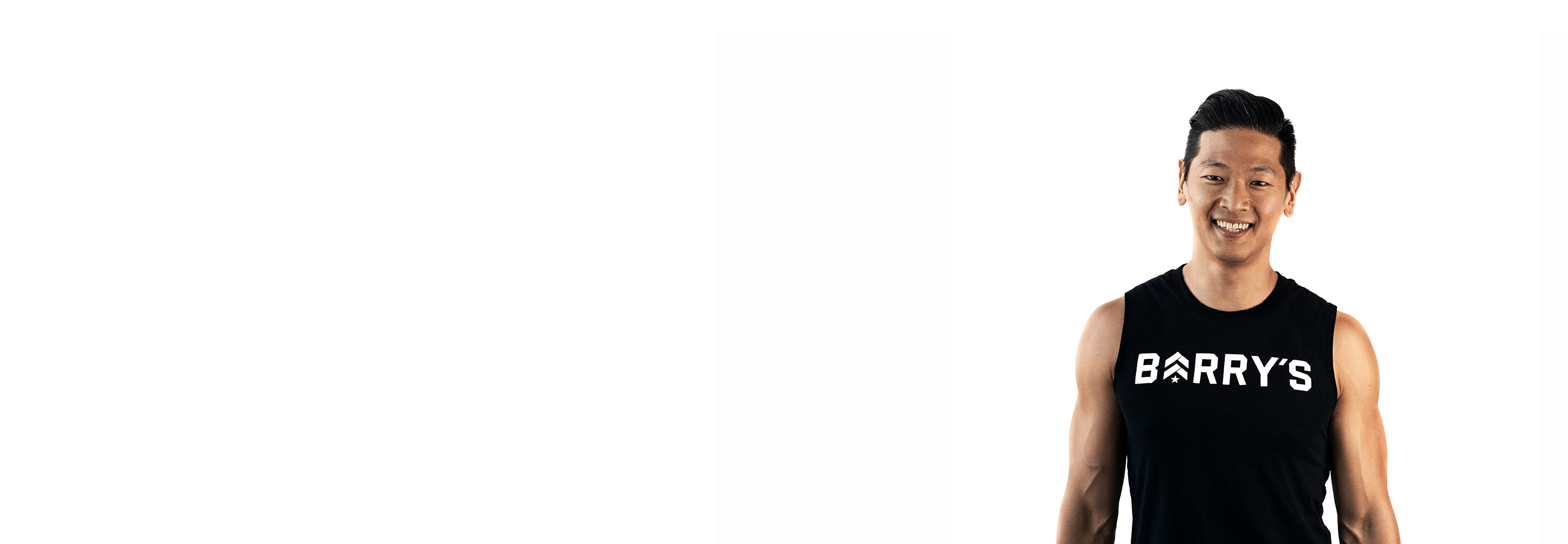 Barry's instructor standing confidently wearing a black top against a white background.