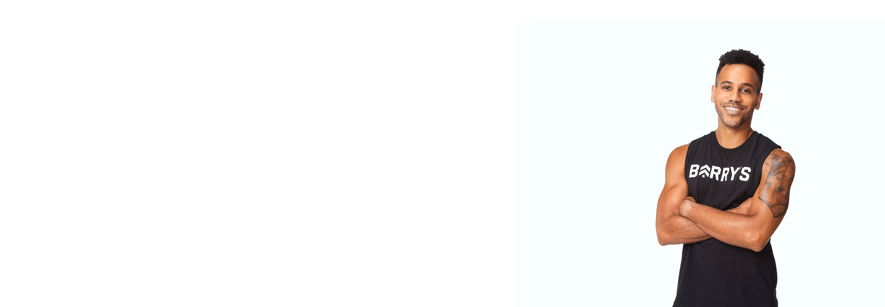 Barry's instructor standing confidently wearing a black top against a white background.