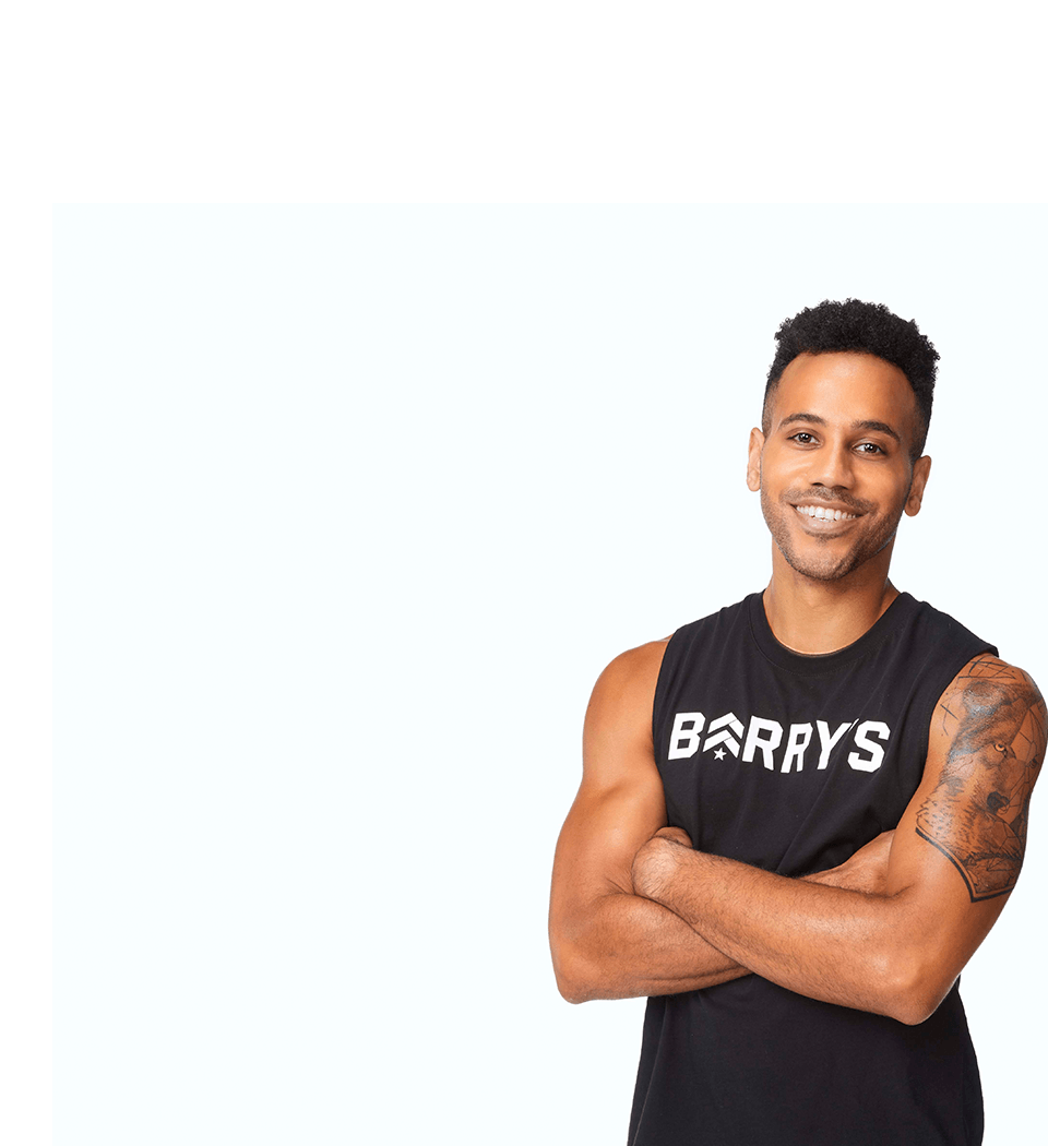 Barry's instructor standing confidently wearing a black top against a white background.