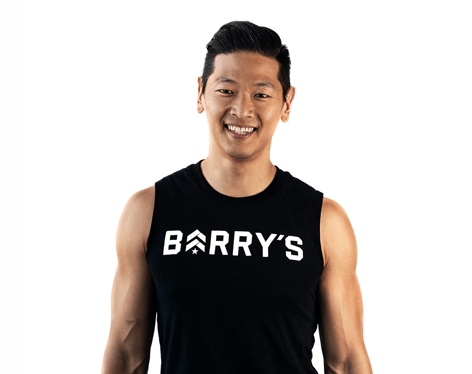 Barry's instructor standing confidently wearing a black top against a white background.