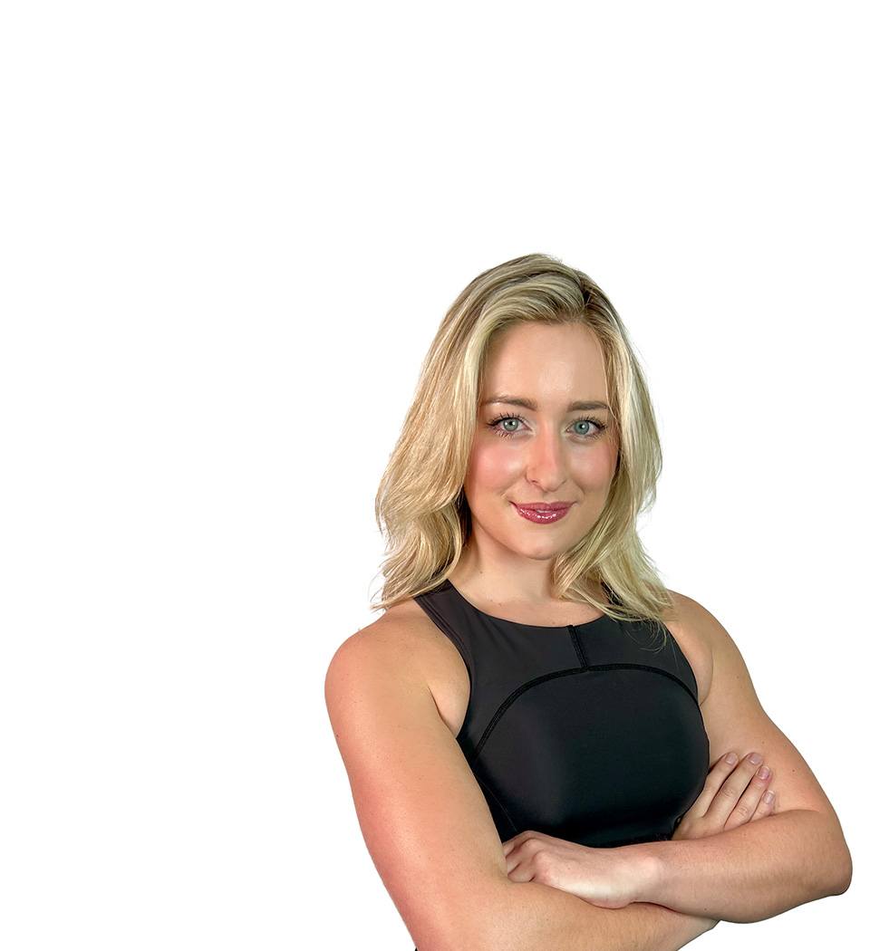 Barry's instructor standing confidently wearing a black top against a white background.